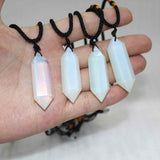 Colier cu cristal vindecator Opal 4-5 cm, in forma hexagonala cu dublu varf si saculet satin negru - pentru protectie, vointa si noroc
